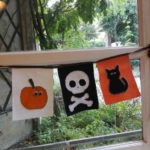 Guirlande de fanions halloween avec citrouille, tête de mort et chat